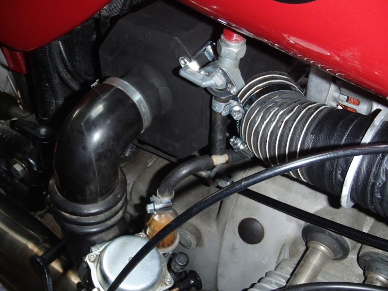 Coude de sortie de la boîte à air